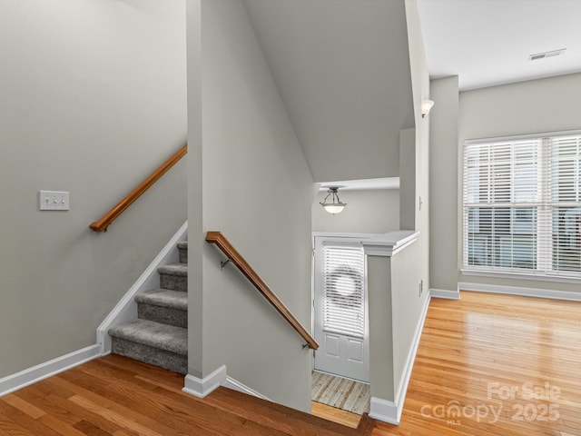 stairs with wood-type flooring