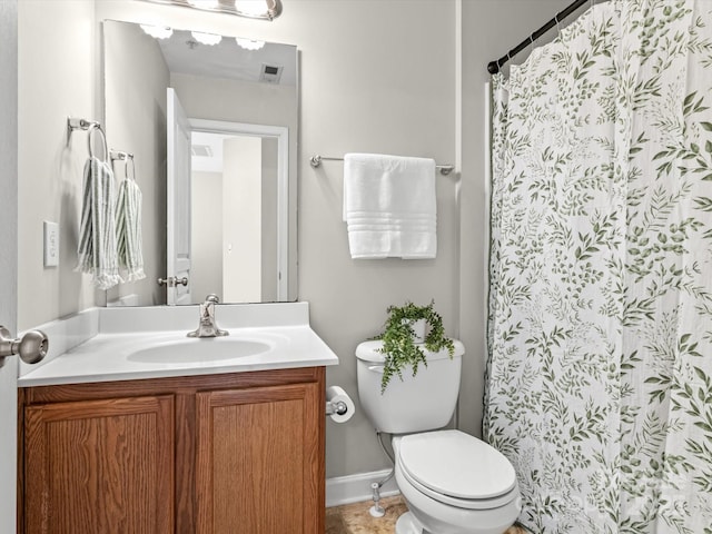 bathroom featuring vanity, toilet, and a shower with curtain