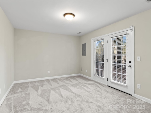 carpeted empty room featuring electric panel