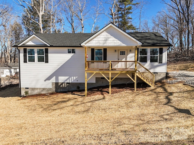 view of front of house with crawl space, stairway, and roof with shingles