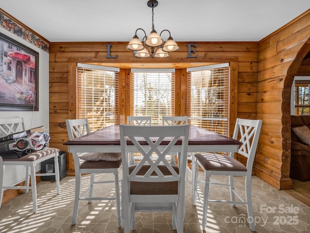 dining space with a chandelier