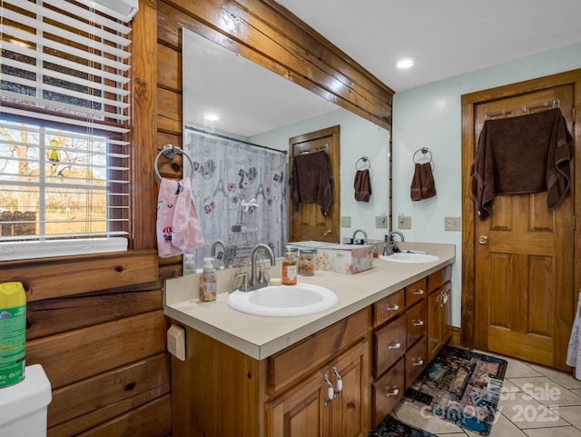 bathroom with vanity and tile patterned flooring