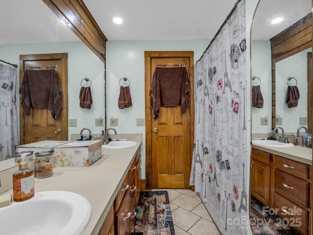 bathroom with tile patterned flooring and vanity