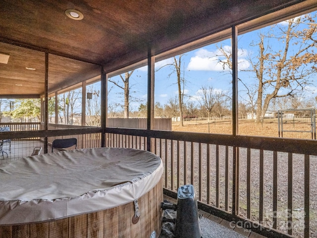 unfurnished sunroom featuring wooden ceiling