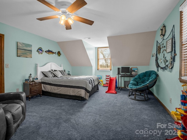 carpeted bedroom featuring vaulted ceiling and ceiling fan