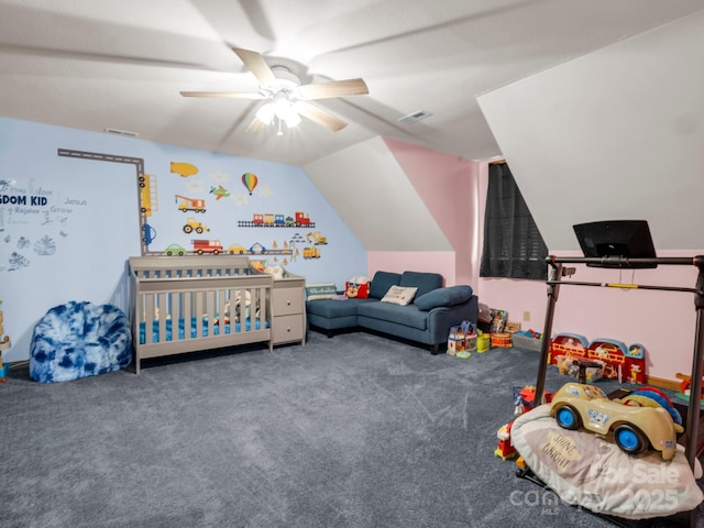 playroom with vaulted ceiling, ceiling fan, and carpet floors