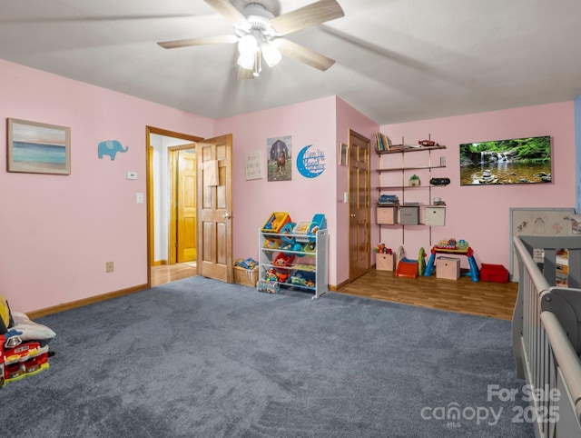 playroom featuring carpet floors and ceiling fan