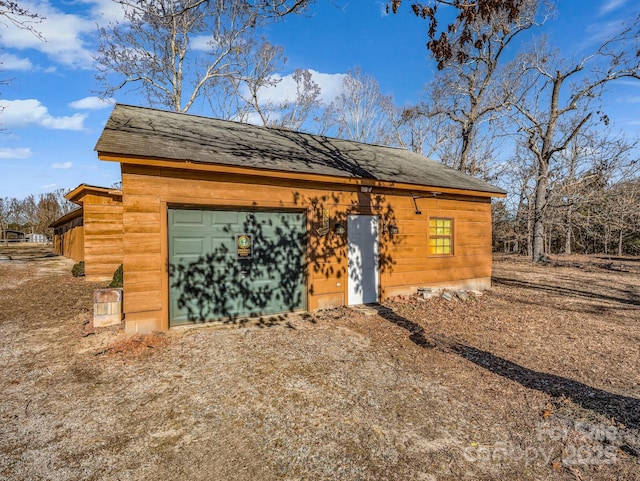 view of outbuilding featuring a garage