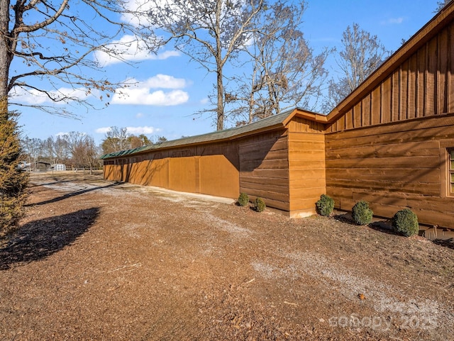 view of side of home with an outbuilding