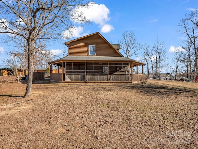 back of property featuring a sunroom