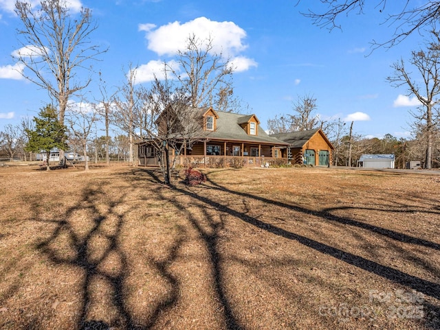 exterior space with a porch and a yard