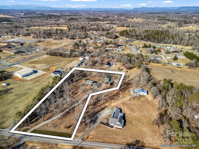 drone / aerial view featuring a mountain view