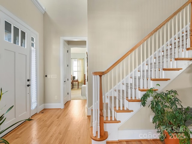 foyer with light hardwood / wood-style floors