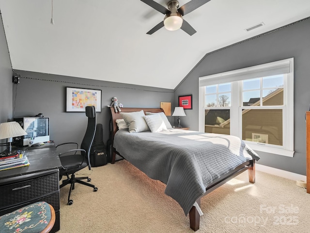 bedroom with light carpet, vaulted ceiling, and ceiling fan