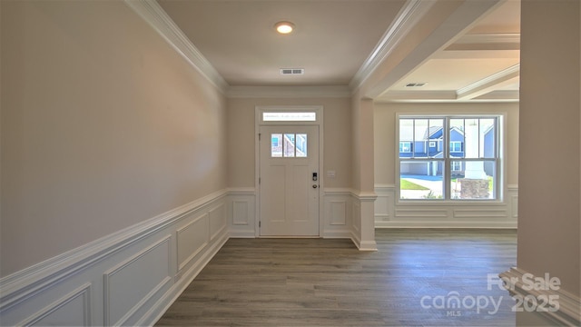 doorway to outside with crown molding and dark hardwood / wood-style flooring