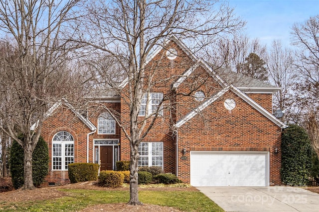 view of property featuring a garage and a front lawn