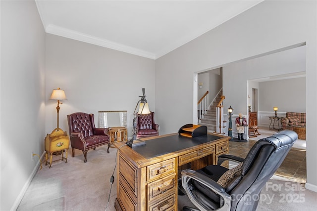 carpeted office space featuring crown molding