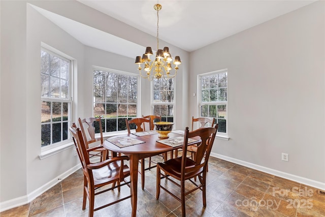 dining area featuring a notable chandelier