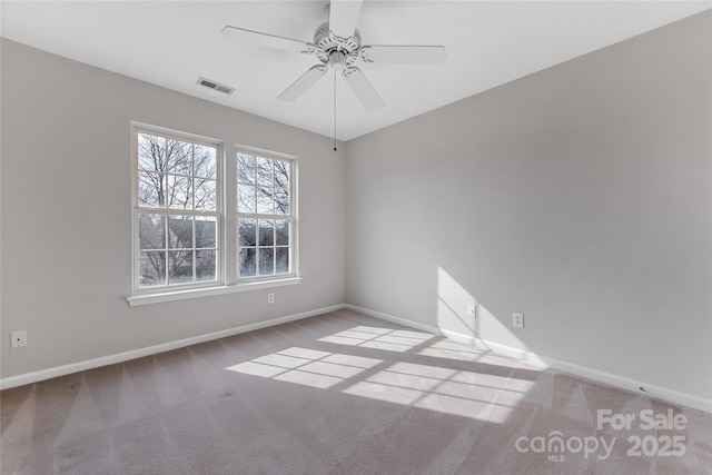 carpeted empty room with ceiling fan