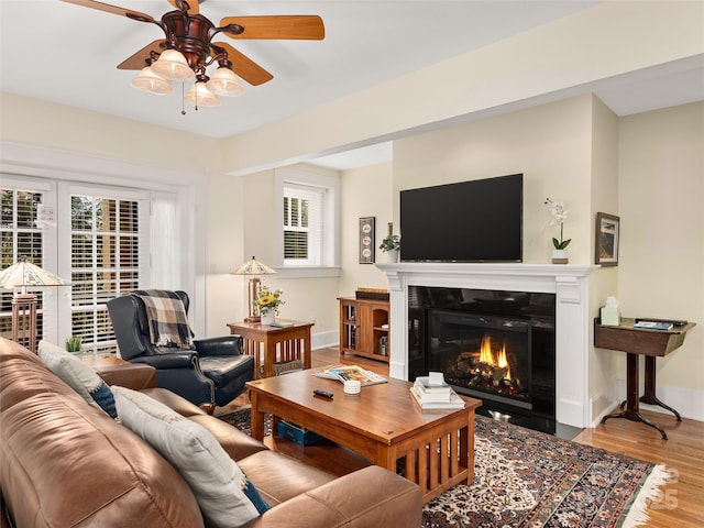 203 6th Ave W Unit 1B, Hendersonville, NC 28739 - living area featuring wood finished floors, healthy amount of natural light, ceiling fan, and a tile fireplace