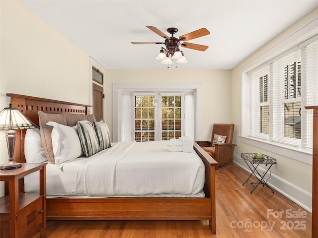 203 6th Ave W Unit 1B, Hendersonville, NC 28739 - bedroom with wood finished floors and a ceiling fan