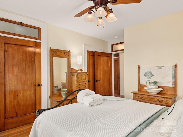 203 6th Ave W Unit 1B, Hendersonville, NC 28739 - bedroom featuring light wood-style flooring and a ceiling fan