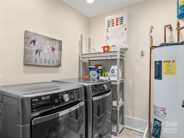 203 6th Ave W Unit 1B, Hendersonville, NC 28739 - washroom featuring electric water heater, washer and dryer, and light tile patterned floors
