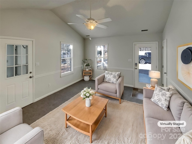 living room with ceiling fan, lofted ceiling, and carpet floors