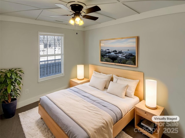 bedroom with ceiling fan and wood-type flooring