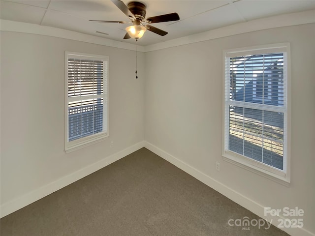 empty room with ceiling fan and carpet