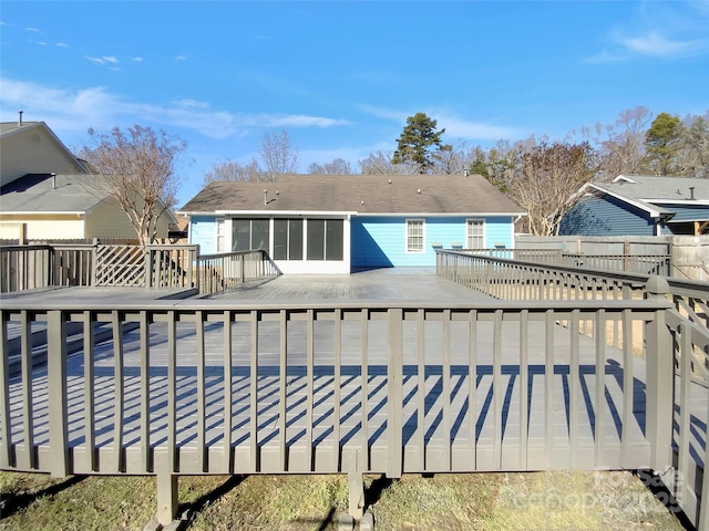 rear view of house with a wooden deck