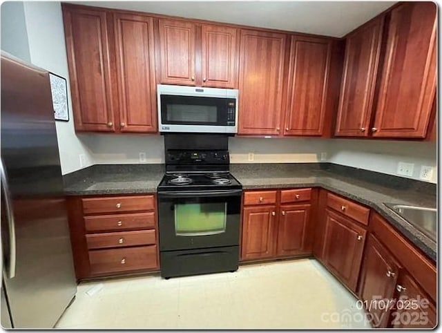 kitchen featuring appliances with stainless steel finishes and sink