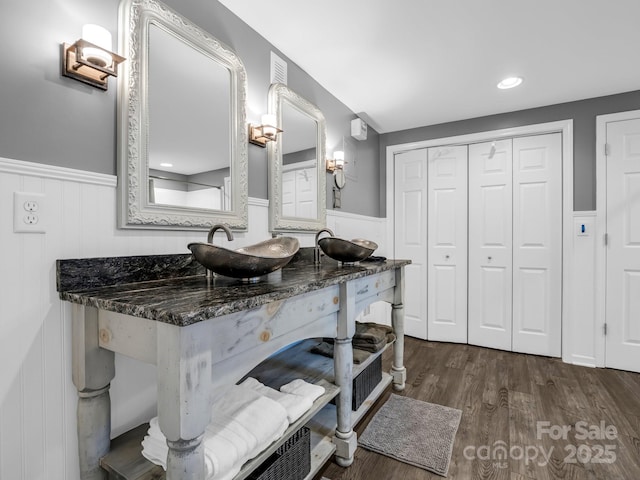 bathroom featuring vanity and wood-type flooring