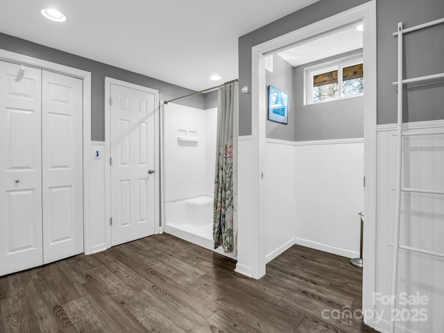 interior space featuring a shower with curtain and wood-type flooring