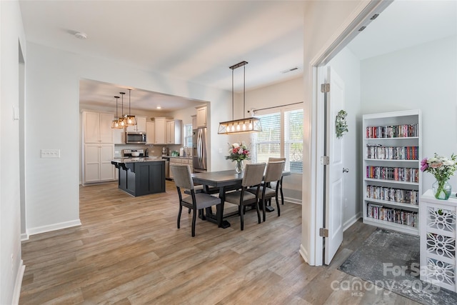 dining room with light hardwood / wood-style floors