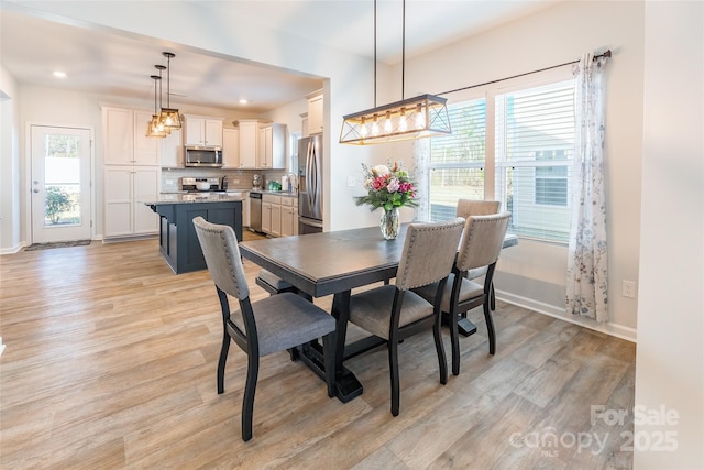 dining room with light hardwood / wood-style floors