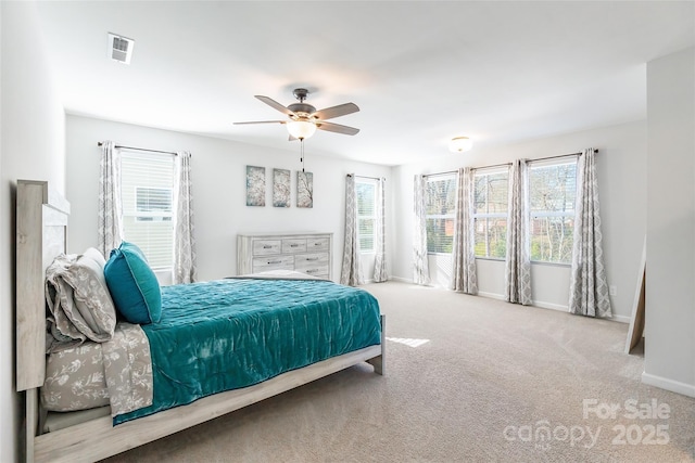 bedroom featuring ceiling fan and light carpet