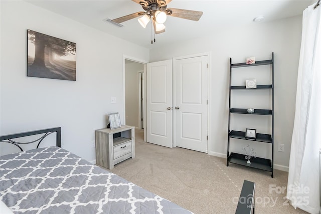 carpeted bedroom with ceiling fan