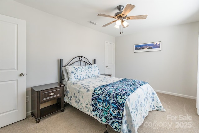 bedroom featuring ceiling fan and carpet