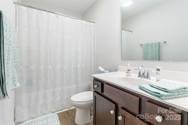 full bathroom with toilet, vanity, shower / bath combo, and hardwood / wood-style flooring