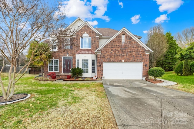 view of front property with a garage and a front yard