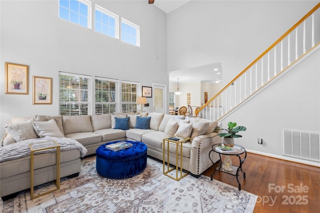 living room featuring plenty of natural light and hardwood / wood-style floors