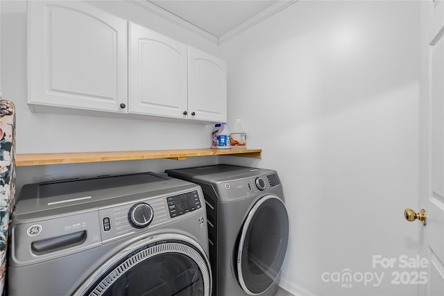 washroom with separate washer and dryer, crown molding, and cabinets