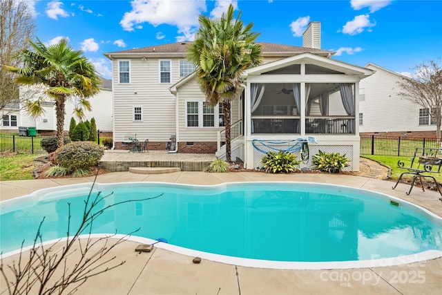 view of swimming pool with a sunroom and ceiling fan