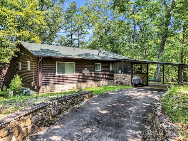 view of front of home with a carport