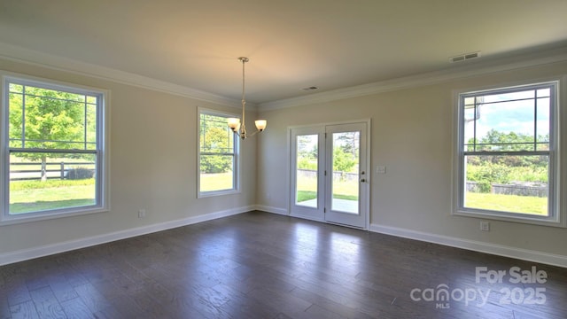 interior space with ornamental molding, dark hardwood / wood-style flooring, and a chandelier