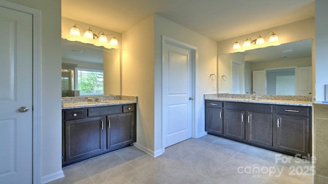 bathroom with vanity, tile patterned flooring, and a shower with shower door