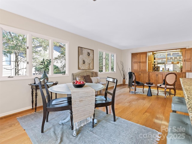 10 Clubside Dr, Asheville, NC 28804 - dining room featuring light wood-style flooring and baseboards