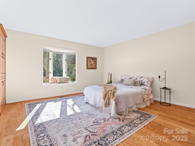 10 Clubside Dr, Asheville, NC 28804 - bedroom featuring light wood-type flooring and baseboards
