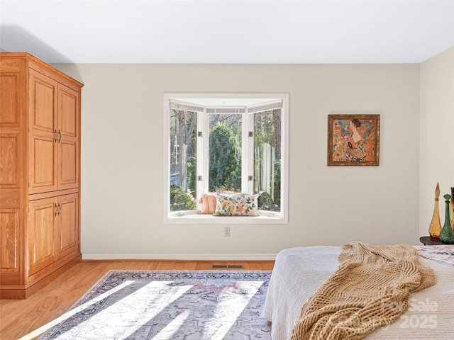 10 Clubside Dr, Asheville, NC 28804 - bedroom with light wood-style floors, baseboards, and visible vents